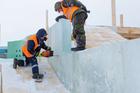 Installers are building an ice town of ice blocks