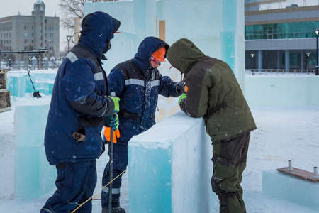Installers are building an ice town of ice blocks