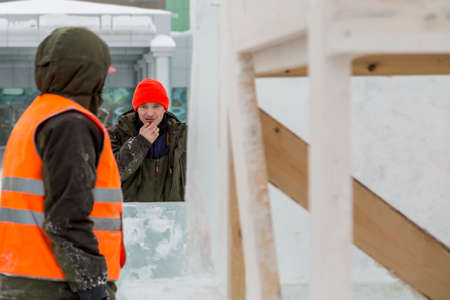 Installers at the construction site of the ice camp discuss a plan for further actionの写真素材