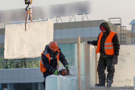 Installers are building an ice town of ice blocks