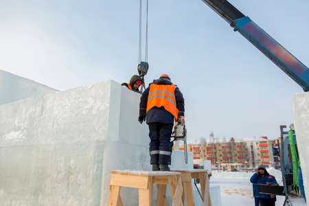 Installers are building an ice town of ice blocks
