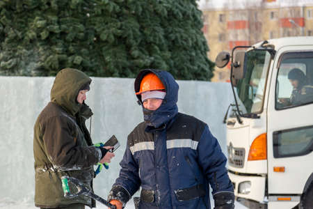 Portrait of a worker walking along the construction site of the ice townの写真素材