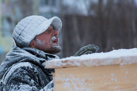 Close-up of a man with hoarfrost face
