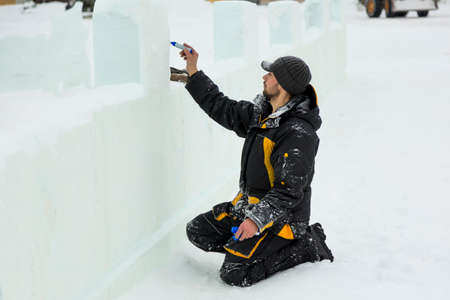 The artist draws the contours of the future ice figure on the iceの写真素材