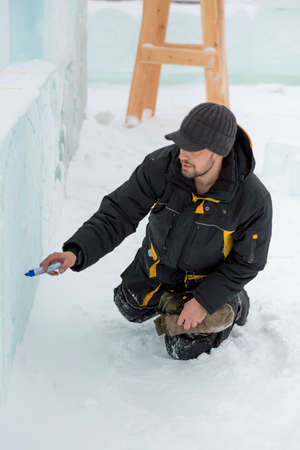The artist draws the contours of the future ice figure on the iceの写真素材