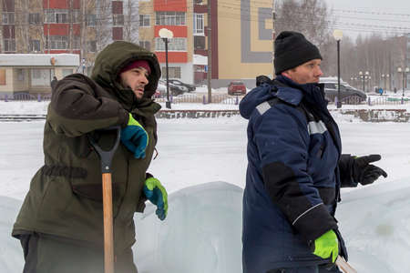 Workers at the construction site of the ice town for a conversationの写真素材