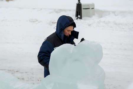 Portrait of a worker engaged in arranging an ice town