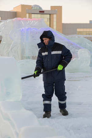 Portrait of a worker engaged in arranging an ice town