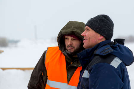 Installers are in a good mood at the construction site talking
