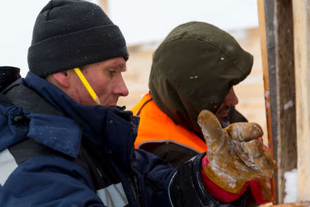 Installers are in a good mood at the construction site talking