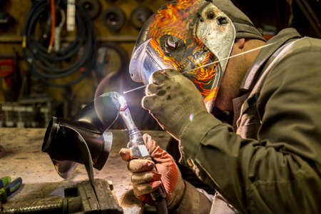 Welding a large car radiator with a gas torch