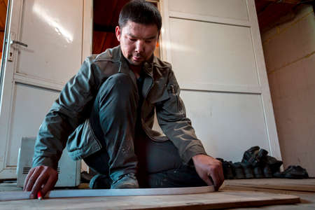 Portrait of male worker close up at workplaceの写真素材