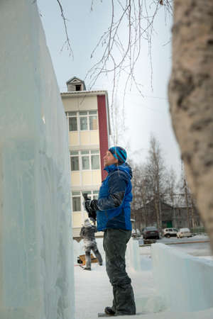 The artist draws the contours of the future ice figure on the iceの写真素材
