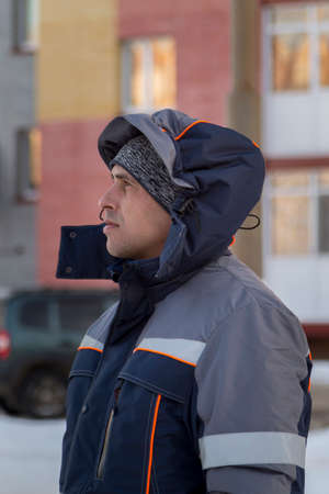 The driver of the hydraulic manipulator in the workplace