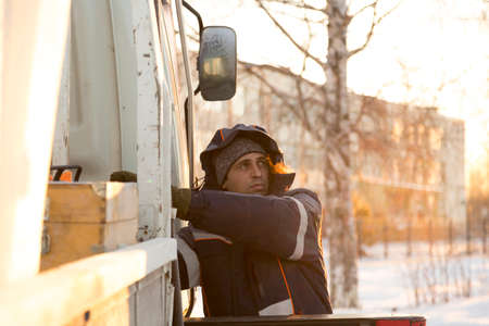The driver of the hydraulic manipulator in the workplace