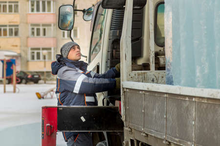 The driver of the hydraulic manipulator in the workplace