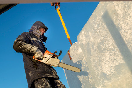 Close-up of the face of a worker in a blue jacket at the workplaceの写真素材