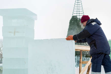 Portrait of a worker installer in uniform at the ice panelの写真素材