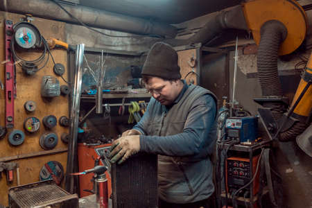 Welding a large car radiator with a gas torch