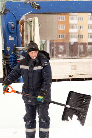 Mounters at the ice block at the assembly site with a hood on their heads