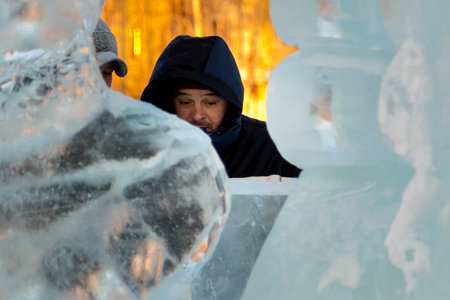Workers at the construction site of the ice town for a conversation