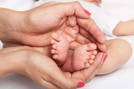 Baby feet in mother hands baby feet in mother hands.