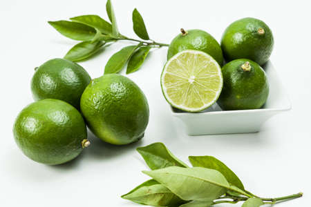 Green lemon tahiti or Citrus latifolia, isolated on neutral background.の写真素材