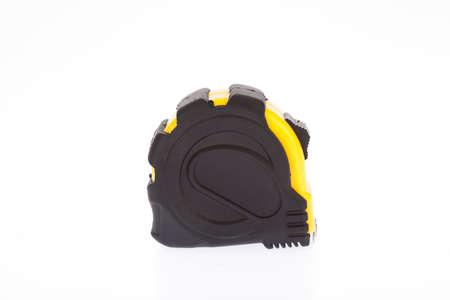 Yellow flexometer with black on white background.