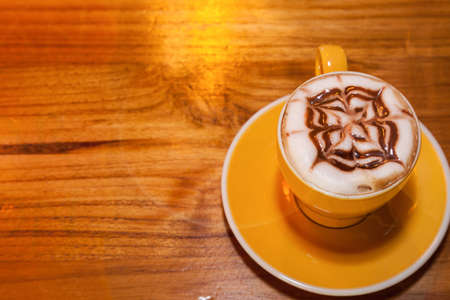 Tasty cappuccino with figure on the foam.