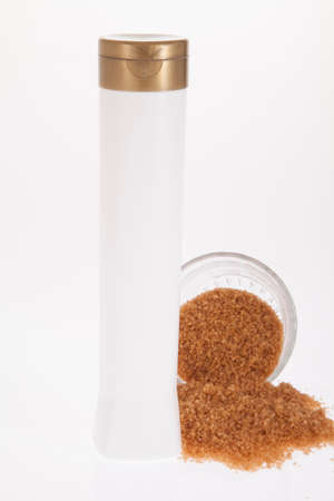 Multipurpose container; white plastic jar with golden lid - photo on white background.の写真素材
