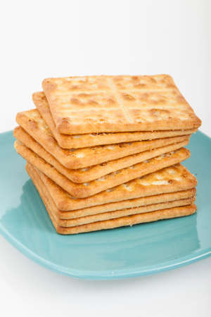 crackers on a plate on white backgroundの写真素材