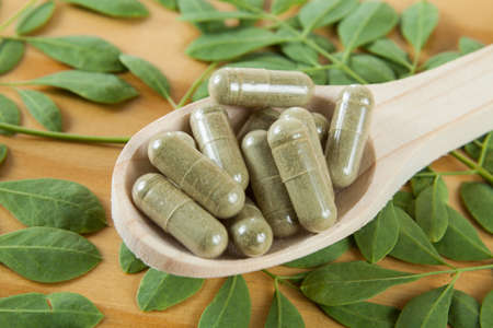 Capsules with powder moringa (Moringa oleifera)の写真素材