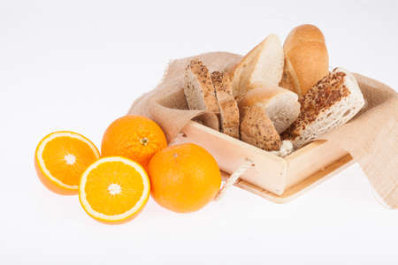 Different and tasty breads with oranges; Photo on white background.の写真素材