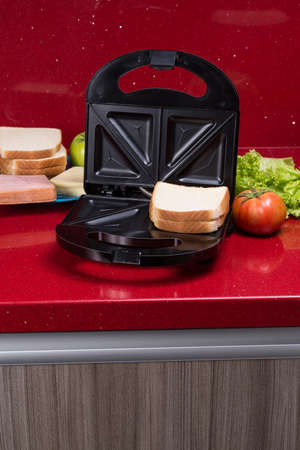 Sandwich maker; photo with ingredients to make sandwiches.