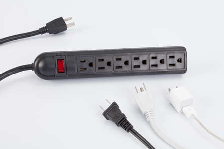 Black surge protector; photo on white background.の写真素材