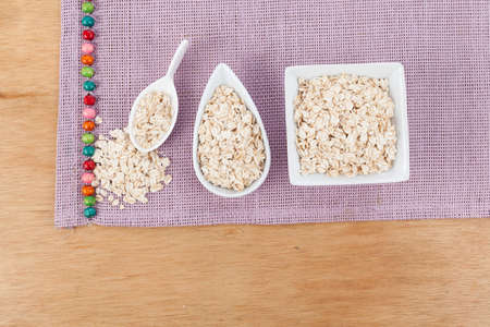 Flaked oatmeal a very healthy cereal.の写真素材