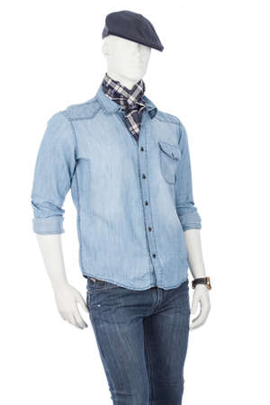 Male mannequin dressed in a shirt with blue jean beret and plaid scarf on white background.の写真素材