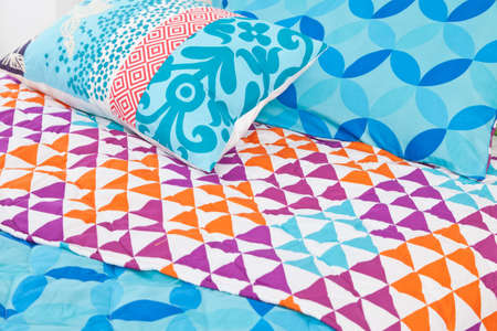 Modern bedding set with geometric shapes.