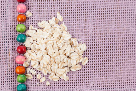 Flaked oatmeal a very healthy cereal.の写真素材