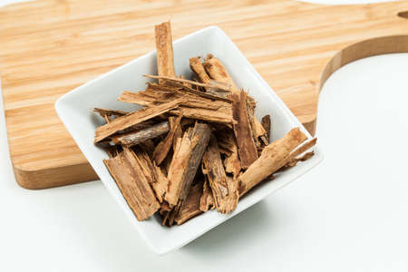 Splintered cinnamon on a neutral background.の写真素材