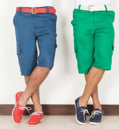 Two Men In Shorts Green And Blue Colors On White Background.の写真素材