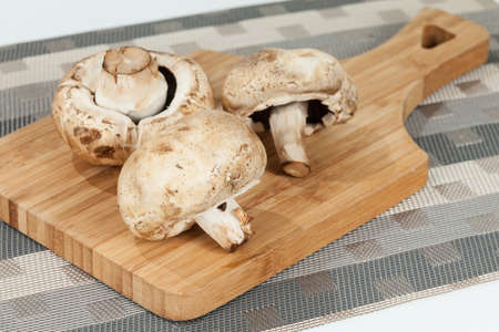 Mushrooms On Wooden Kitchen Chopping Board.の写真素材