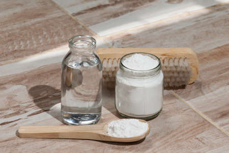 Baking soda - sodium bicarbonate and vinegar, photo on the house floor.