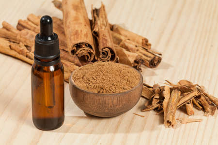Extract liquid of Cinnamon; photo on wooden background.の写真素材