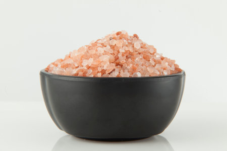 Pink salt from the Himalayas; photo on white background.の写真素材