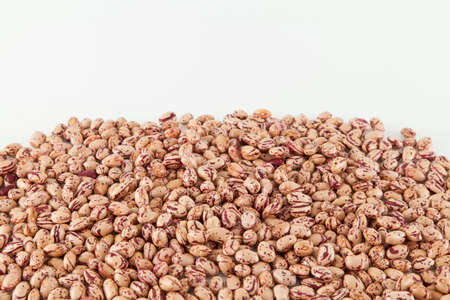 Pinto beans, a legume native to the American continent; photo on white background.の写真素材