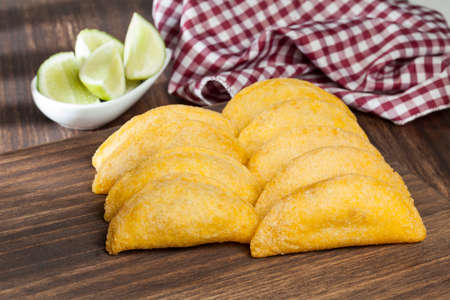 Tasty empanadas - Colombian cuisine; photo on wooden backgroundの写真素材