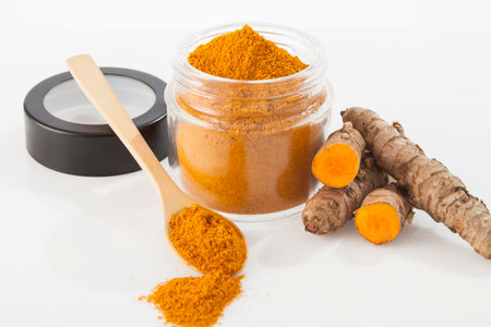Fresh organic root and turmeric powder - Curcuma longa; Healthy Food.