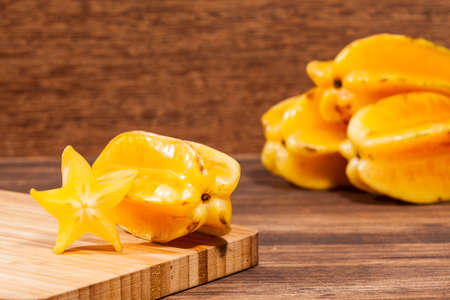 Averrhoa Carambolo - Star Fruit Or Carambola; Photo On Wooden Backgroundの写真素材