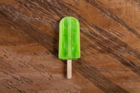 Tasty And Refreshing Lemon Flavor ice cream; On Wooden Backgroundの写真素材